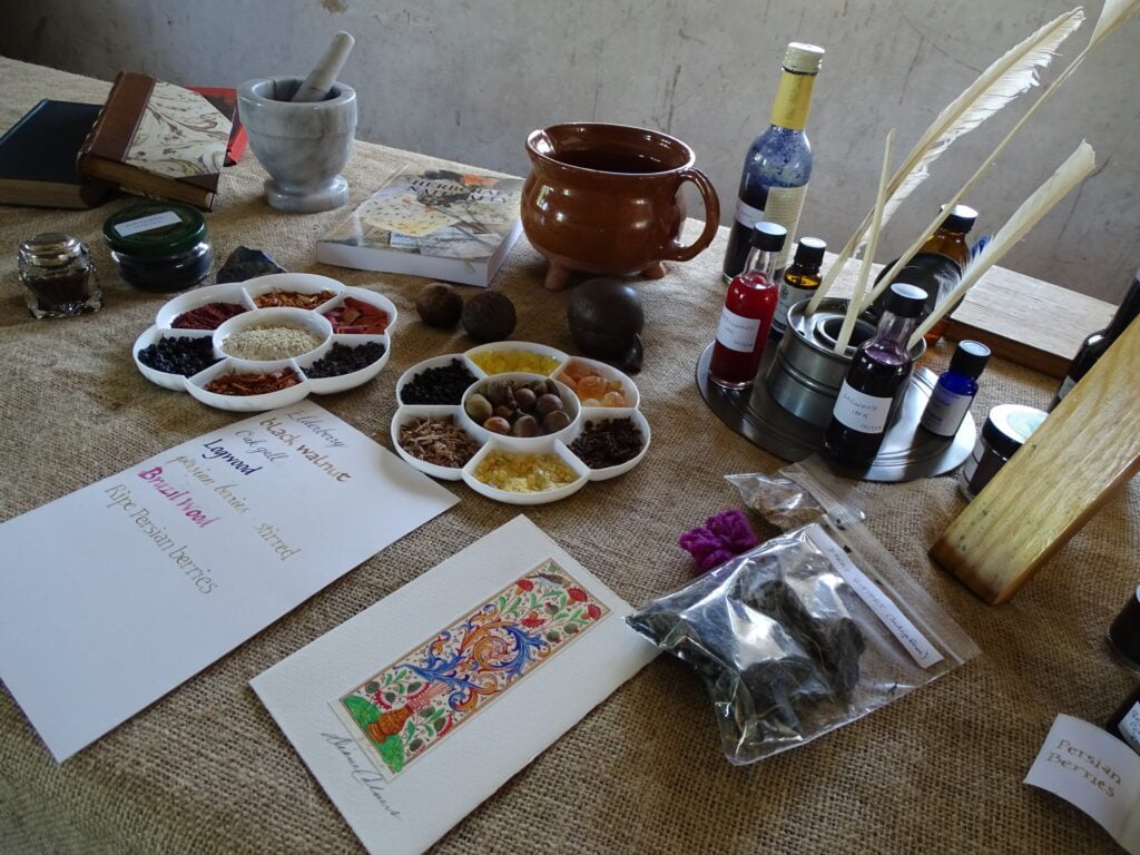 Table with natural products herbs and dried fruits with calligraphy. Medical Herbalist, Medical Herbalist Books, Medical Herbalist Training, Medical Herbalist Courses, Christina Stapley Medical Herbalist
